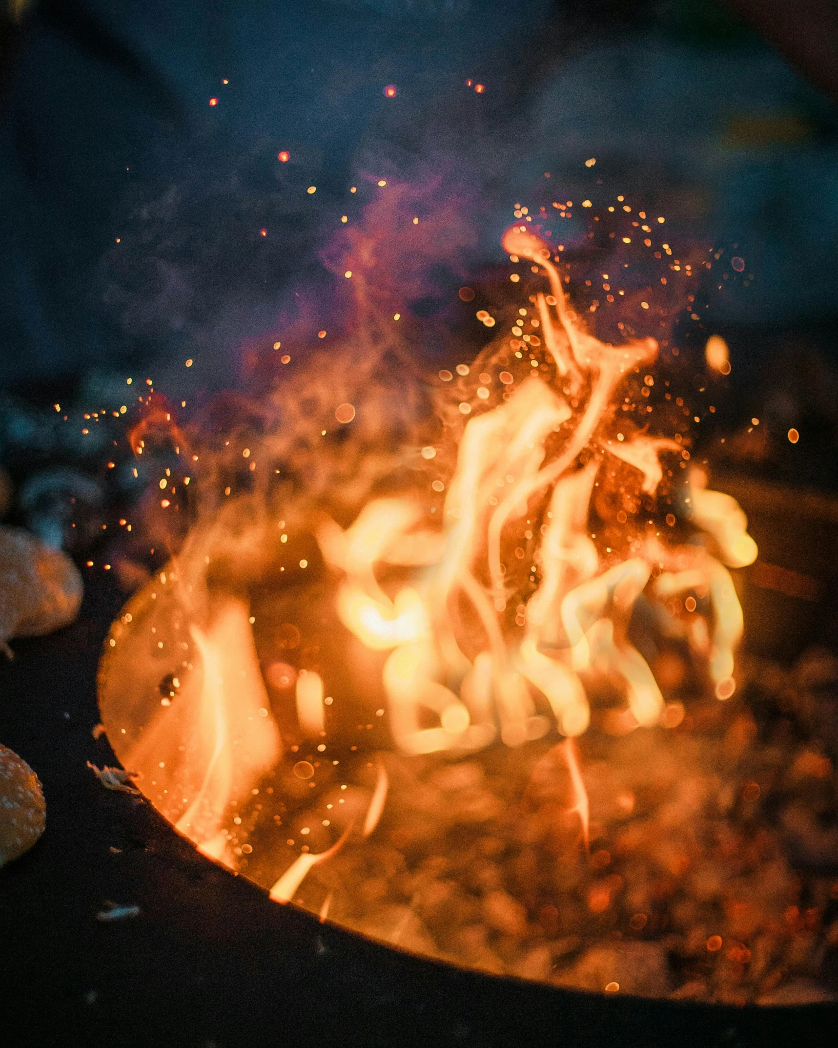 a close up of a frying pan filled with food, embers flying, profile image, instagram picture, fire pit