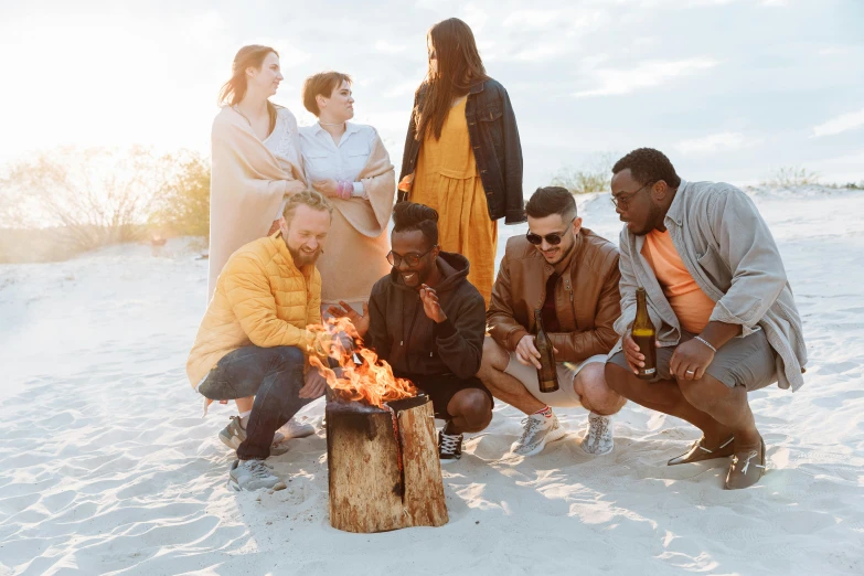 a group of people sitting around a fire pit, pexels contest winner, standing near the beach, plain background, aboriginal australian hipster, people on a picnic