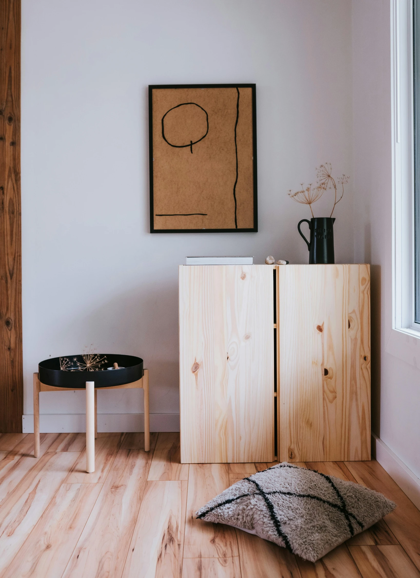 a wooden cabinet sitting on top of a hard wood floor, poster art, inspired by Constantin Hansen, minimalism, pine wood, round format, two, scandinavian / norse influenced