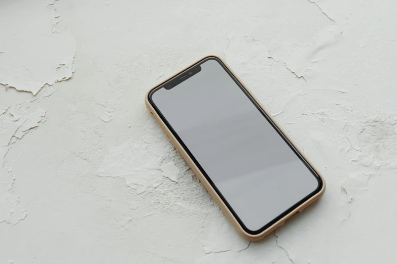 a close up of a cell phone on a table, by Carey Morris, trending on pexels, postminimalism, beige, solid gray, white background : 3, ground - level medium shot