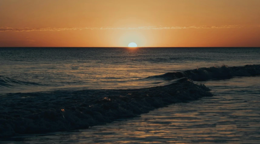 the sun is setting on the horizon of the ocean, a picture, by Robbie Trevino, pexels contest winner, sunset warm spring, beach aesthetic, rippling, desktop wallpaper