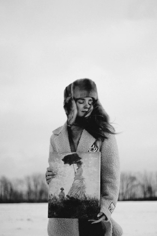 a black and white photo of a woman standing in the snow, a black and white photo, by Lucia Peka, holding a record, beautiful lonely girl, egor letov, medium format. soft light