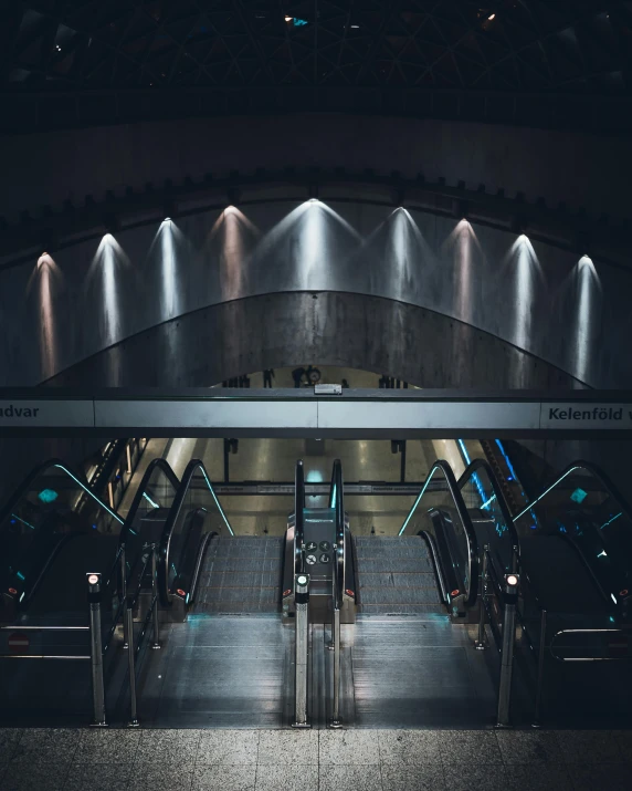 an escalator in a subway station at night, unsplash contest winner, light and space, spaceship hangar, thumbnail, grey, flooded station