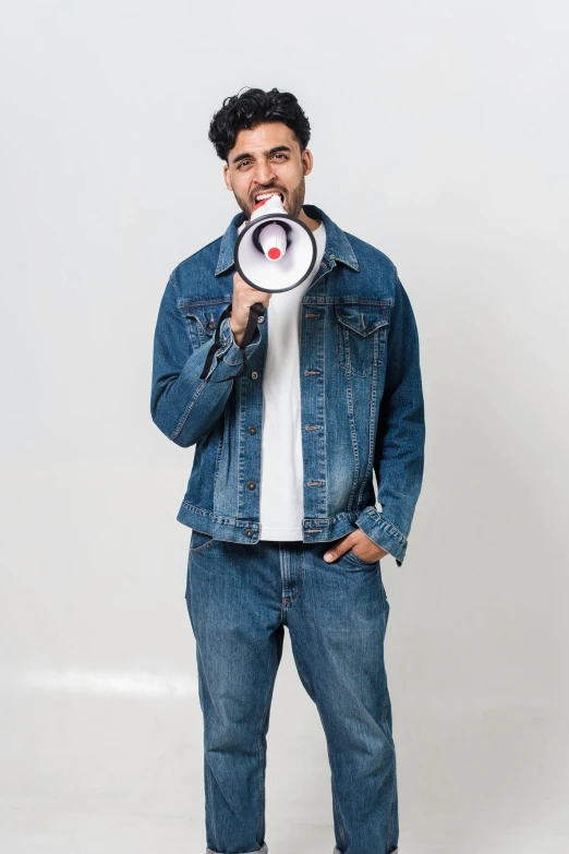 a man in a denim jacket holding a megaphone, inspired by Ismail Gulgee, official store photo, round-cropped, 15081959 21121991 01012000 4k, enes dirig