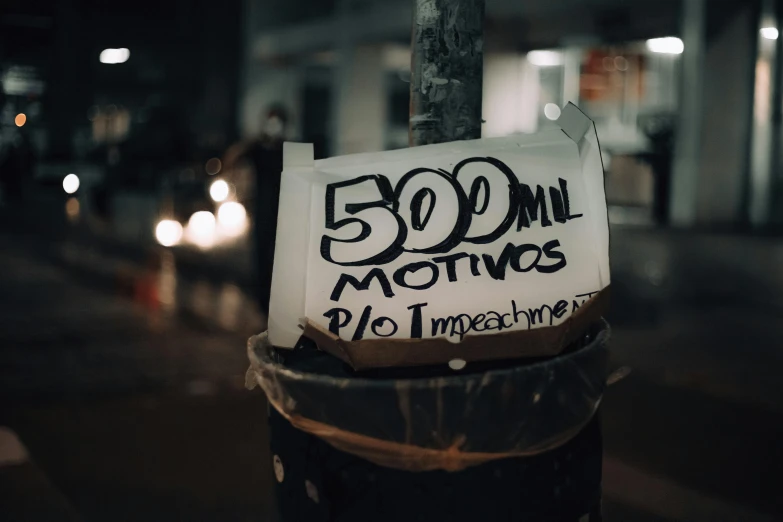 a close up of a sign on a pole, by Sam Dillemans, trending on unsplash, graffiti, in sao paulo, moonless night, 5 0 0 px models, begging for alms