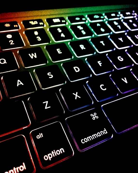 a close up of a keyboard on a table, multicoloured, highlighted, thumbnail, cybertech