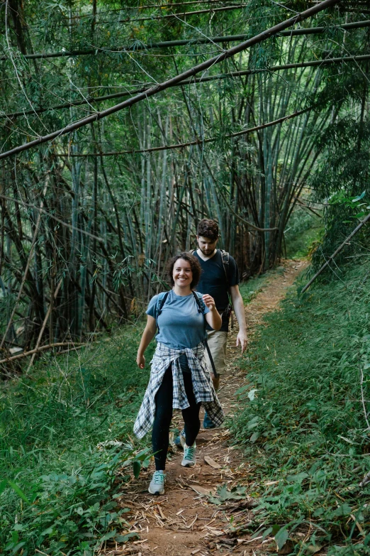 a couple of people that are walking in the woods, unsplash, renaissance, kauai, bamboo, in the hillside, male and female