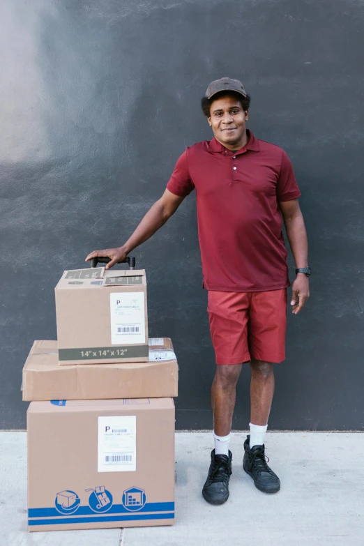 a man standing next to a stack of boxes, dribble contest winner, wearing golf shorts, maroon, jayison devadas, full product shot