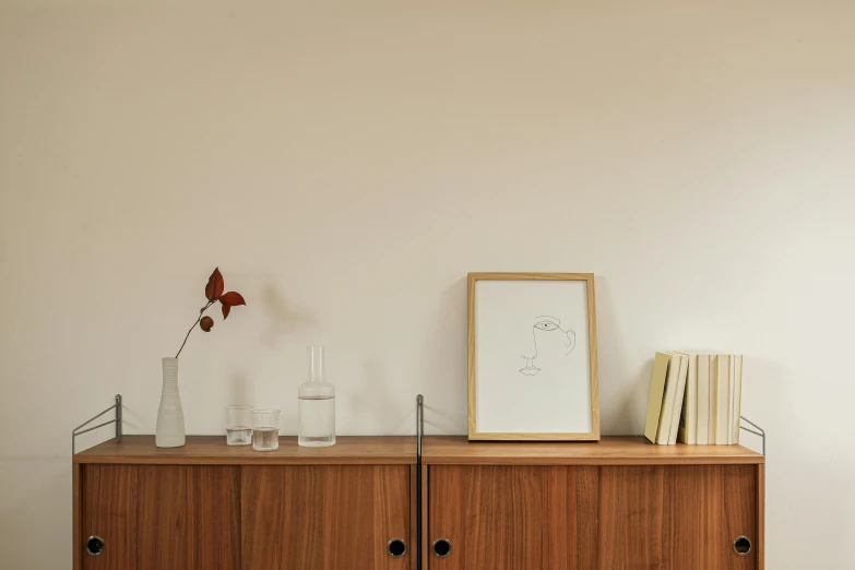 a white vase sitting on top of a wooden dresser, a minimalist painting, inspired by Agnes Martin, postminimalism, single line drawing, ocher details, with clear glass, recessed