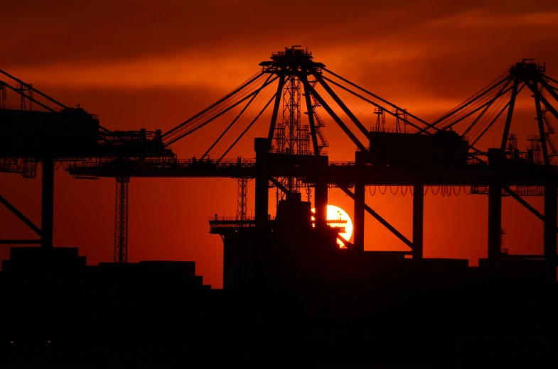 the sun is setting behind a cargo ship, a portrait, ap, city of industry, no crop, silhouette :7