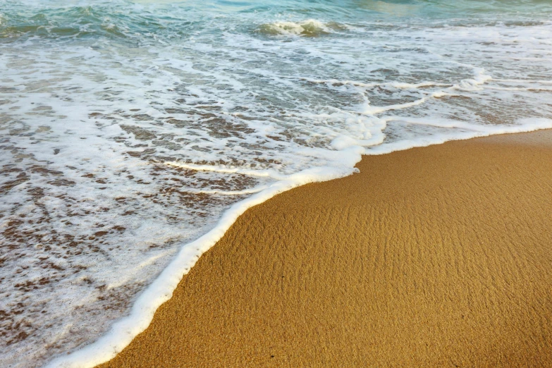 a large body of water sitting on top of a sandy beach, pexels contest winner, renaissance, sea foam, brown, mediterranean, ripple