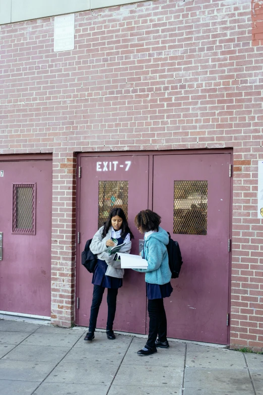 a couple of people standing in front of a building, ashcan school, lockers, private academy entrance, emily rajtkowski, young girls