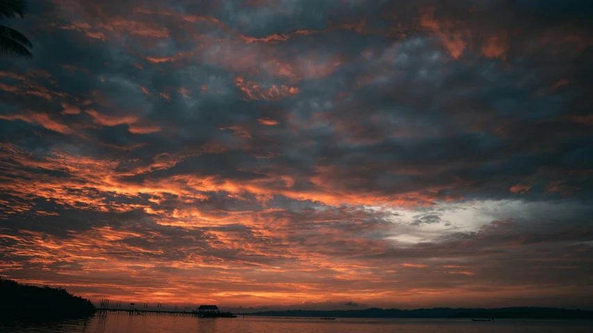 a large body of water under a cloudy sky, a picture, by Charlotte Harding, pexels contest winner, romanticism, orange and red sky, grey, goodnight, today\'s featured photograph 4k