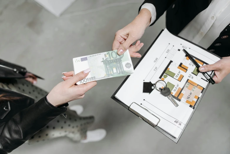 a man handing money to a woman in a black jacket, a digital rendering, by Emma Andijewska, pexels contest winner, architectural plans, flat, collectors, very tiny