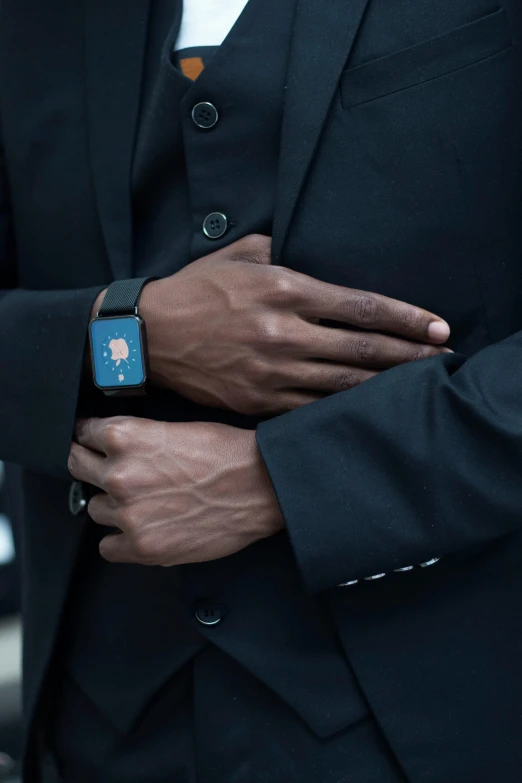 a close up of a person wearing a suit and tie, by Adam Marczyński, unsplash, heart rate, man is with black skin, tech wear, various posed