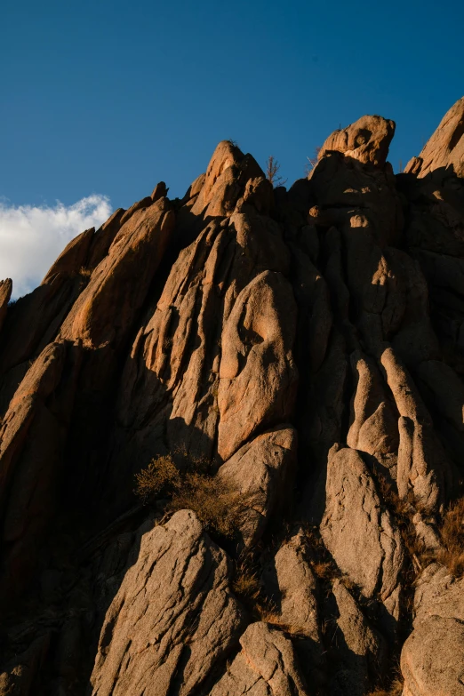 a man flying through the air while riding a snowboard, a portrait, unsplash, baroque, ((rocks)), photo of shiprock, morning detail, panoramic