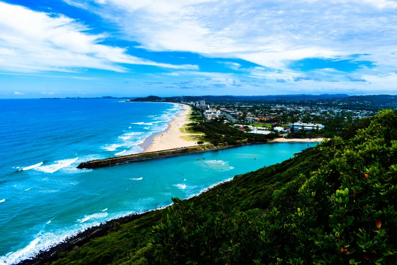 a view of a beach from the top of a hill, pexels contest winner, gold coast australia, blue and clear sky, festivals, 💋 💄 👠 👗