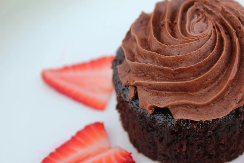 a chocolate cupcake with chocolate frosting and strawberries, unsplash, hurufiyya, profile image, view from below, manuka, sideview