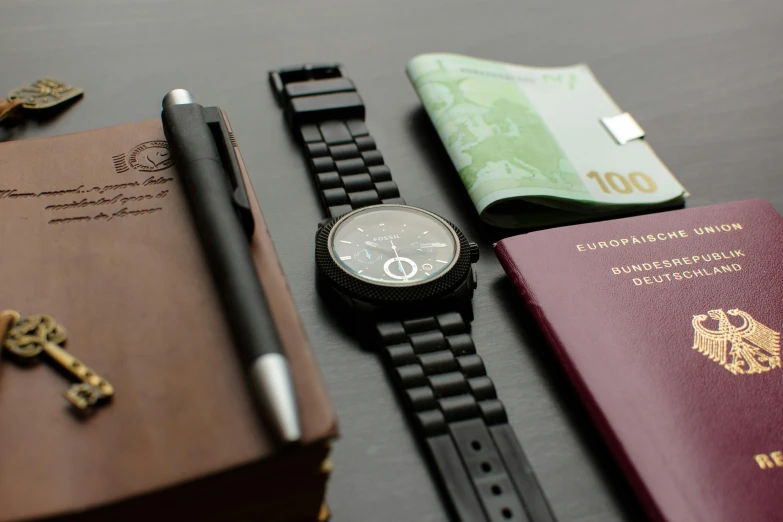 a watch sitting on top of a table next to a passport, pexels contest winner, private press, all black matte product, service ticket close up, thumbnail, fra