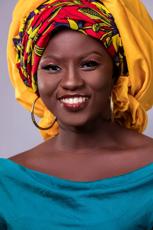 a woman with a colorful turban on her head, an album cover, by Chinwe Chukwuogo-Roy, pexels contest winner, smiling fashion model face, brown skin. light makeup, square, studio photo