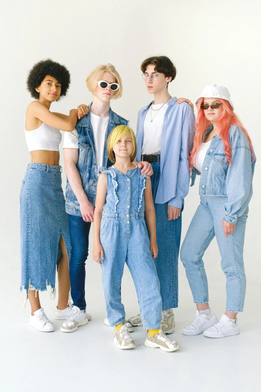 a group of women standing next to each other, trending on pexels, renaissance, double denim, die antwoord yolandi visser, cardboard cutout, family friendly