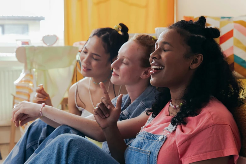 a group of women sitting on top of a couch, trending on pexels, anya taylor joy, sing for the laughter, avatar image, vhs