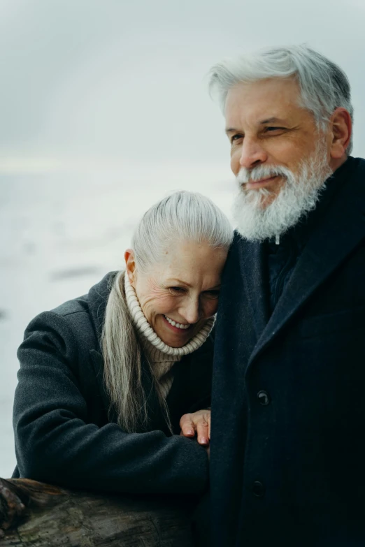 a man and a woman standing next to each other, pexels contest winner, grey trimmed beard, winter, silver，ivory, profile image