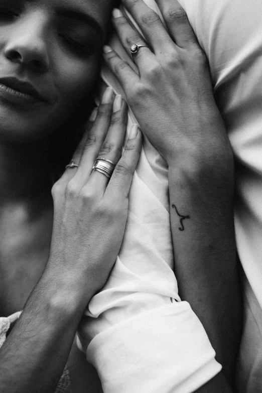 a black and white photo of a man and a woman, by Emma Andijewska, trending on pexels, realism, photo of a hand jewellery model, line drawing tattoos, :: morning, pisces