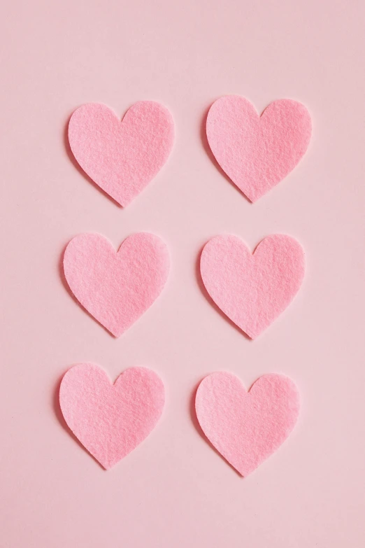pink felt hearts on a pink background, an album cover, trending on pexels, pixel perfect, wedding, 1 5 9 5, food