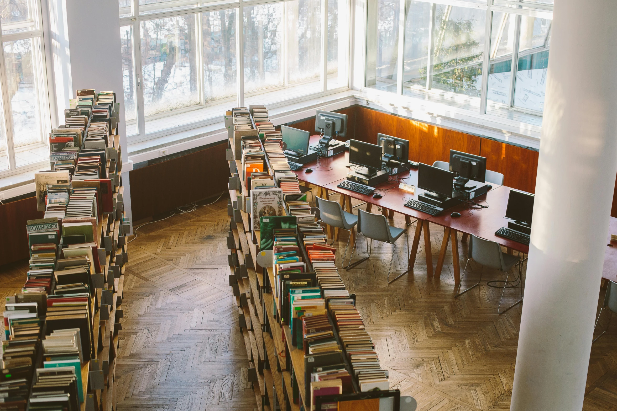 a large room filled with lots of books, pexels contest winner, danube school, azamat khairov, brass equipment and computers, 90's photo, full body image