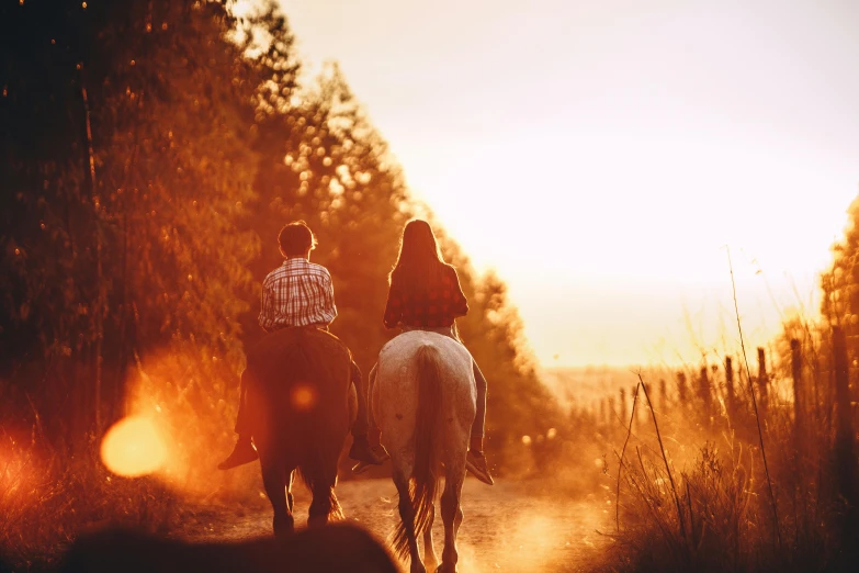 two people riding horses down a dirt road, by Emma Andijewska, golden hour lighting, 👰 🏇 ❌ 🍃, profile image, al fresco