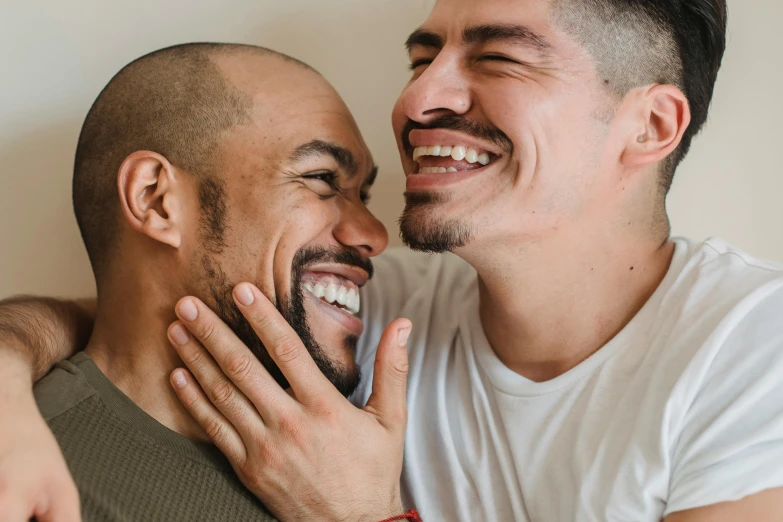 a couple of men standing next to each other, trending on pexels, smiling mouth, intimately holding close, partially bald, prideful
