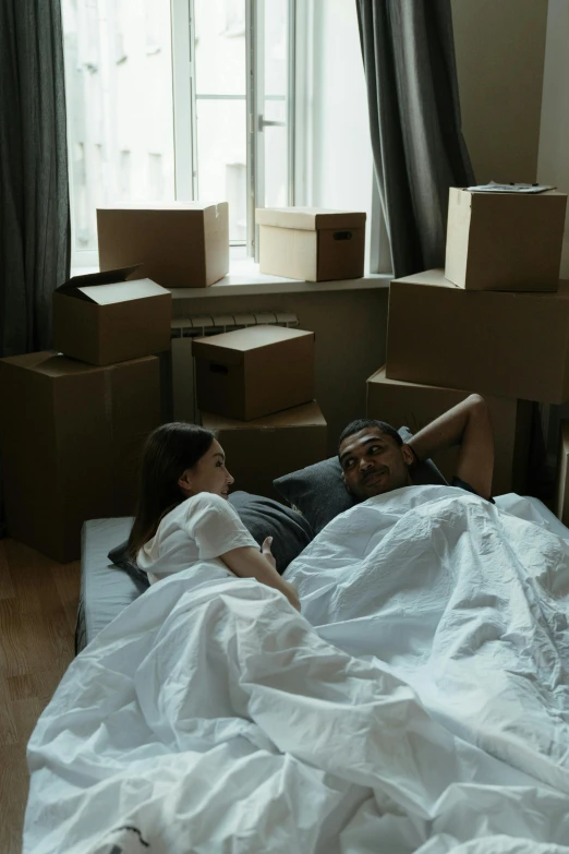 a man and a woman laying in a bed, pexels contest winner, cardboard tunnels, inspect in inventory image, marriage, small bedroom