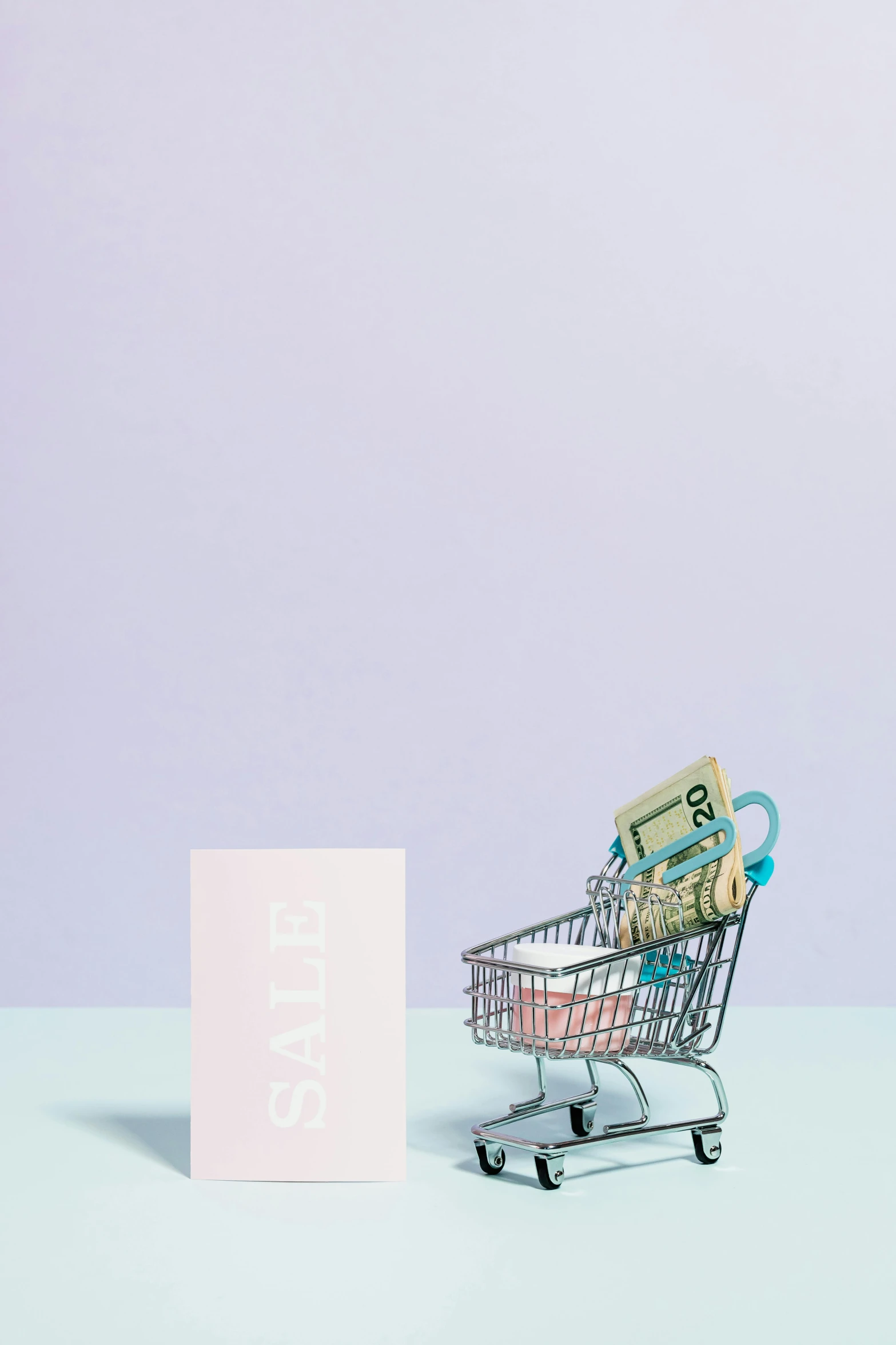 a shopping cart sitting next to a business card, a digital rendering, pexels, arper's bazaar, pastel overflow, money, clemens ascher