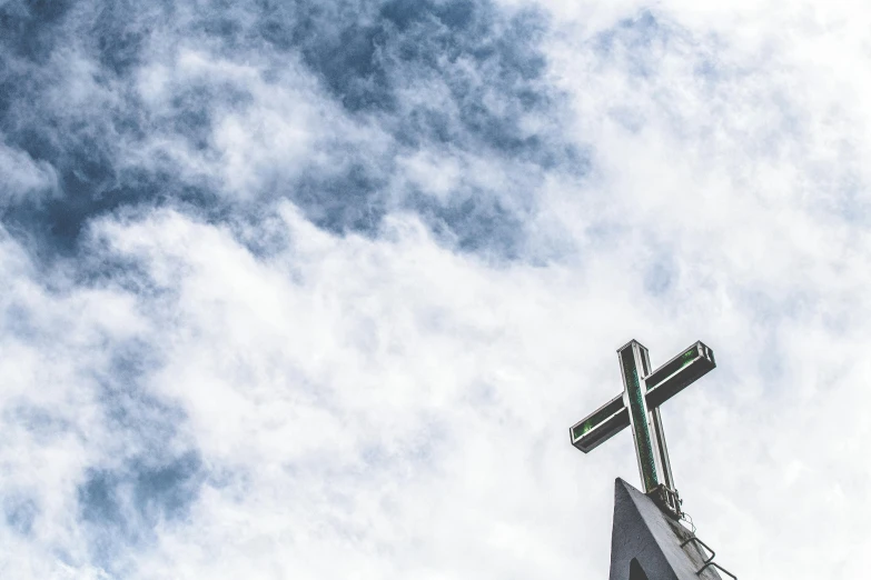 a church steeple with a cross on top of it, a photo, unsplash, hurufiyya, rectangle, te pae, celebration, profile image