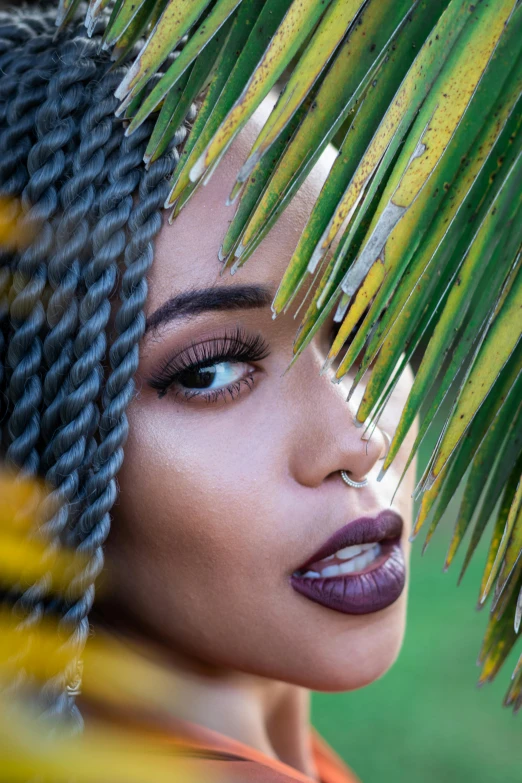 a close up of a person under a palm tree, afrofuturism, dark lips, photoshoot for skincare brand, grey contacts, profile image