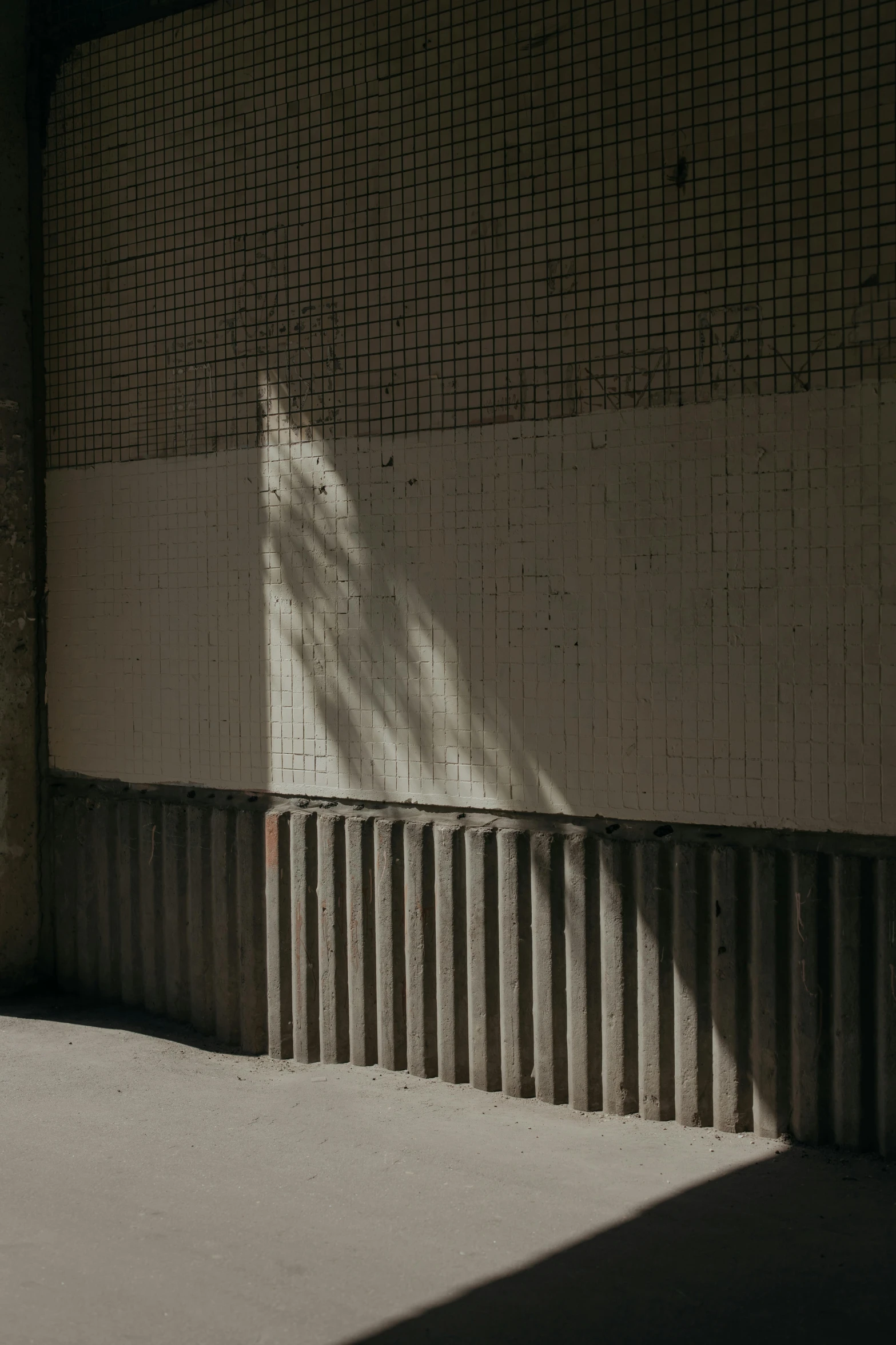 a man riding a skateboard up the side of a building, inspired by Elsa Bleda, unsplash, conceptual art, trees cast shadows on the wall, concrete _ wall ) ], location [ chicago ( alley ) ], concrete pillars