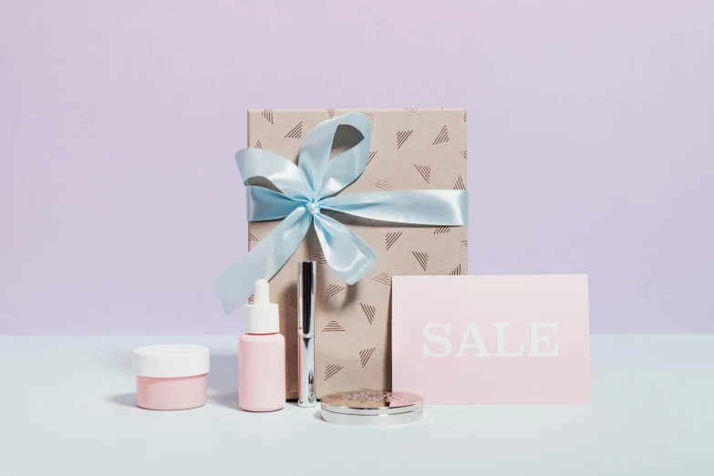 a gift box sitting on top of a table, pastel makeup, sales, clean design, half and half