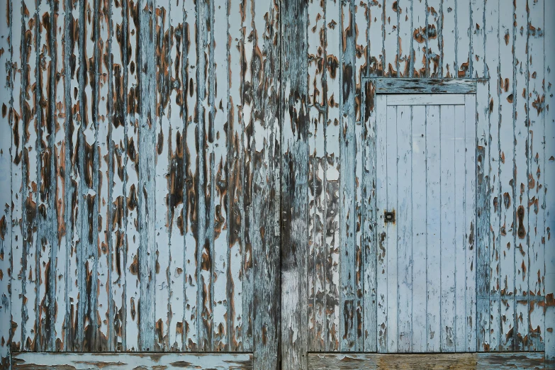 a red fire hydrant sitting in front of a blue door, an album cover, by Paul Davis, conceptual art, rustic wood, blue gray, alessio albi, barn