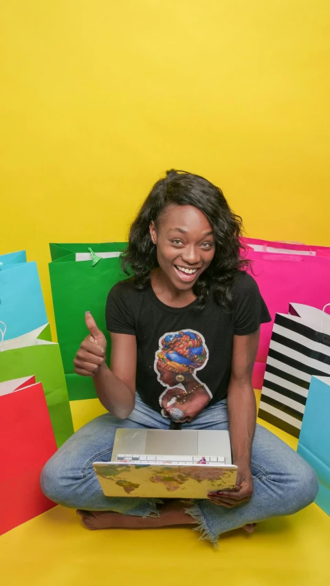 a woman sitting in front of a pile of shopping bags, by Stokely Webster, happening, nerdy black girl super hero, ecommerce photograph, earing a shirt laughing, snapchat photo