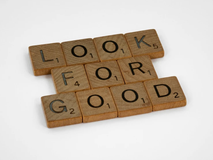 wooden scrabbles spelling look for good on a white background, inspired by Frederick Goodall, trending on unsplash, visual art, award - winning brand agency, commission for, 1940s photo, sustainable materials