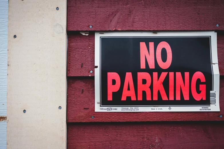 a no parking sign on the side of a building, by Julia Pishtar, pexels, square, thumbnail, a park, multi-part