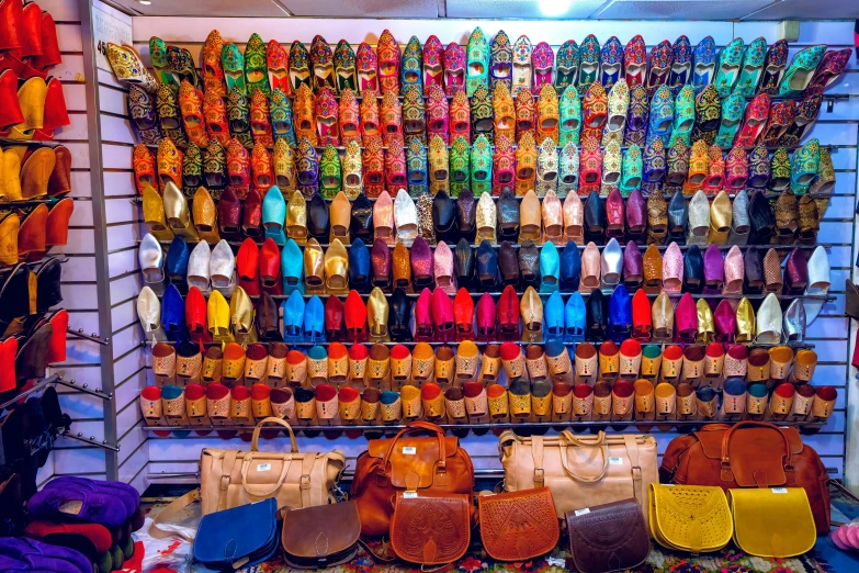 a room filled with lots of colorful handbags and purses, by Emanuel Witz, trending on unsplash, renaissance, moroccan city, slippers, 🦩🪐🐞👩🏻🦳, panoramic shot