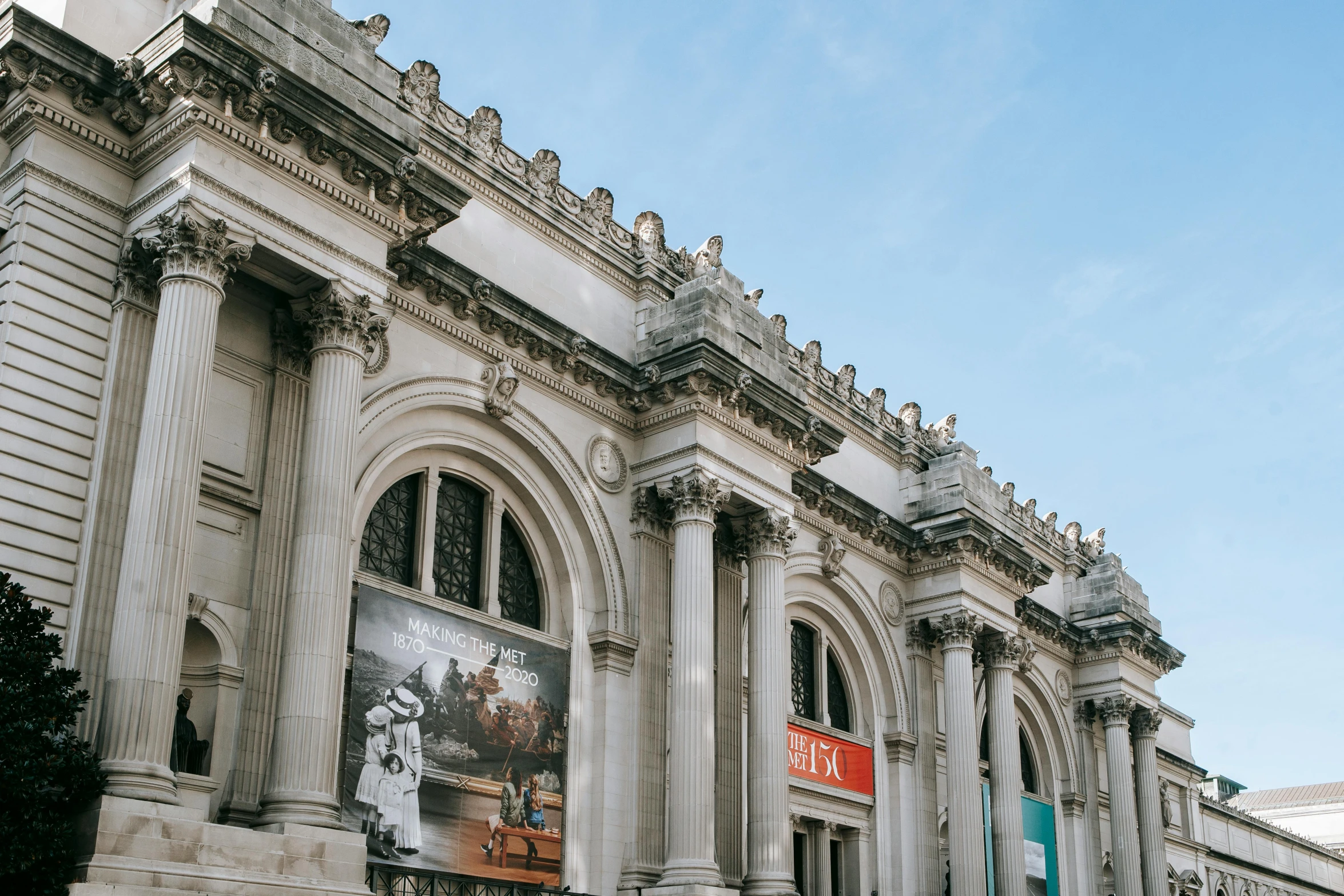 a couple of people that are standing in front of a building, by Carey Morris, pexels contest winner, neoclassicism, the metropolitan museum of art, building facing, thumbnail, jean - michel basquiat