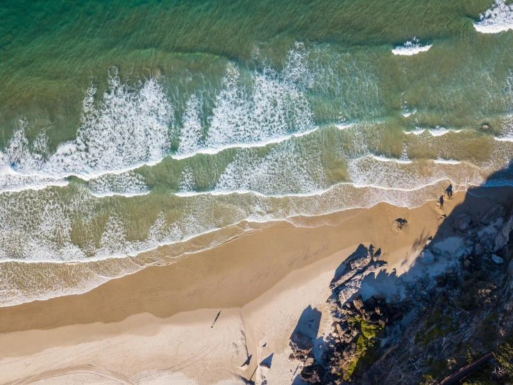 an aerial view of a beach and the ocean, by Peter Churcher, pexels contest winner, “ iron bark, hd footage, profile pic, shoreline