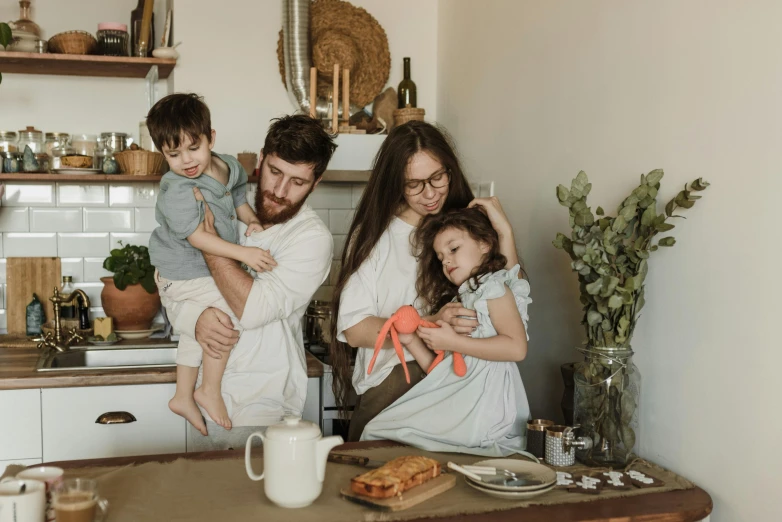 a man, woman, and two children in a kitchen, pexels contest winner, avatar image, relaxed poses, ekaterina, morning hour