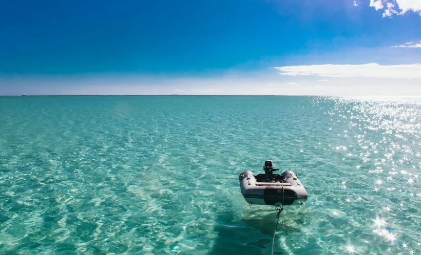 a boat that is floating in the water, hurufiyya, crystal clear blue water, lachlan bailey, over the horizon, dingy