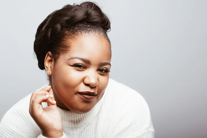 a close up of a person holding a cell phone, an album cover, inspired by Esaias Boursse, unsplash, hurufiyya, plus size woman, headshot portrait, white backround, light-brown skin