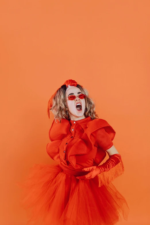 a little girl dressed in a red costume, an album cover, trending on pexels, orange extremely coherent, queer woman, screaming fashion model face, gif