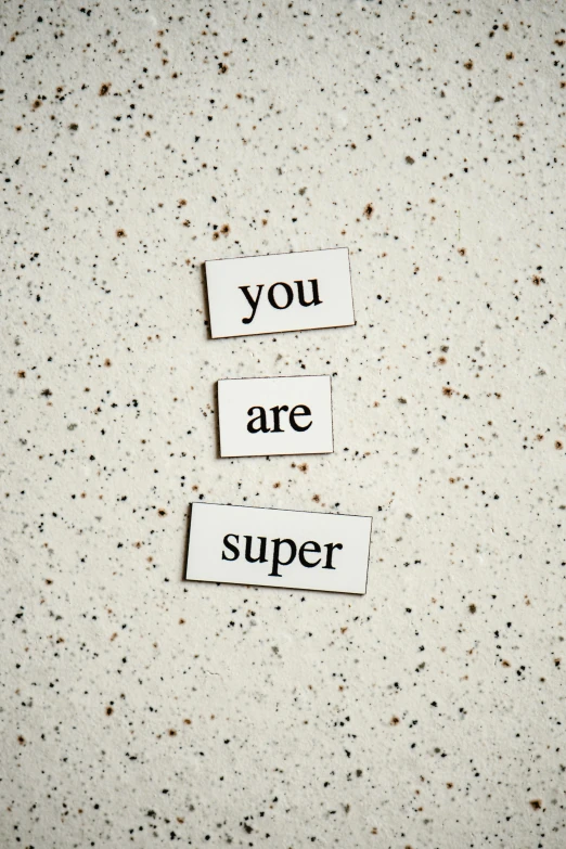 a piece of paper with the words you are super written on it, inspired by Suzanne Duchamp-Crotti, unsplash, magnetic, posing like a superhero, grainy, magnesium